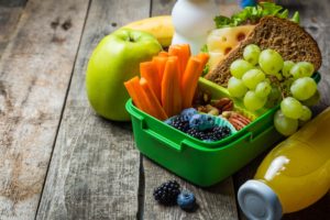 Lunch box with different kinds of fruits